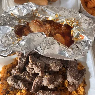 New York Steak and Spicy Shrimp, Pastele lumpia and gandule rice.