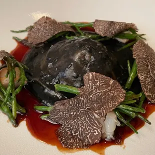 Raviolo langoustine with black truffle and nero ink, brininess light and savory 5/5