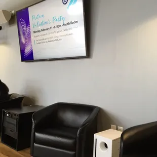 Some comfy chairs and advertising