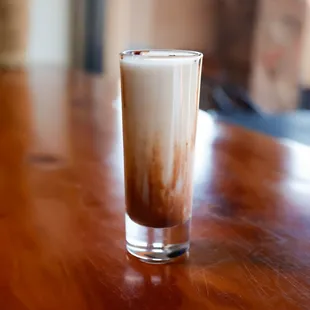 a drink in a tall glass