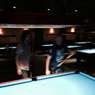 Two guys playing for a few bones out at lacys