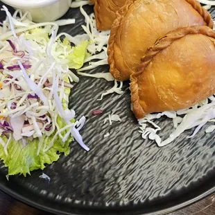 6/12/2024 - An amazing meal at Ladda Thai. These are their chicken karee puffs and cucumber salad.