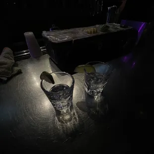 two glasses of water on a table