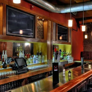 a bar with a row of bar stools