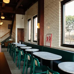 a row of tables and chairs