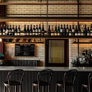 rows of wine bottles on shelves