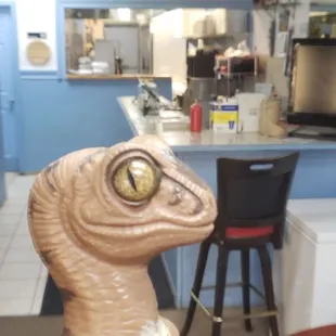 Bob the Raptor says "Sea prey in the kitchen!"