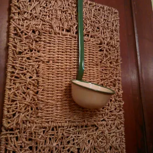 Each booth has a ladle wall hanging.