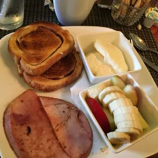 Poached, ham, side of fruit.