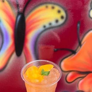 a hand holding a drink