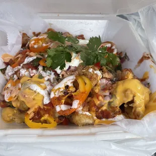 Cauliflower Nachos - Tecate beer battered cauliflower - I have never tasted cauliflower nachos! Delish!
