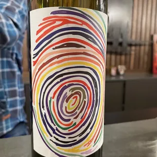a bottle of wine with a fingerprint on it
