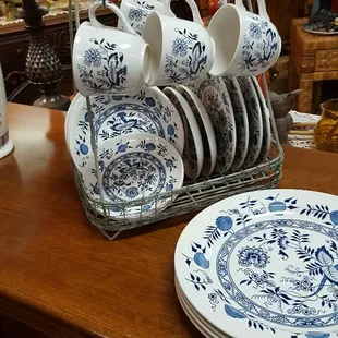 Blue onion plates in a vintage looking rack holder