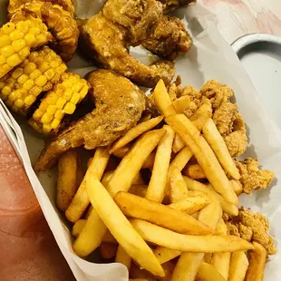 a basket of fried chicken and french fries
