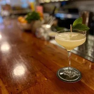 a martini sitting on a bar