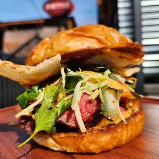 Smoked coulotte steak, rice puff, herb salad, Kari Kari mayo