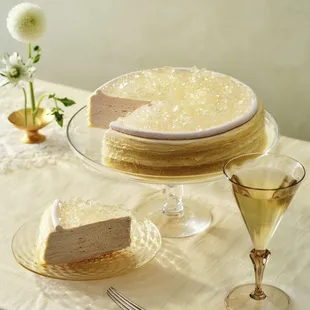 a slice of cake and a glass of wine