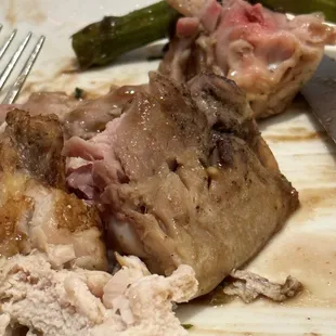 a plate of food with meat and asparagus