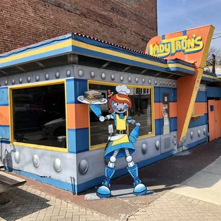 a cartoon character painted on the side of a building