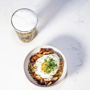 Peruvian fried rice with fried egg and beer.