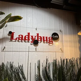 a sign for ladybug cafe