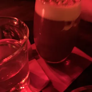 a glass of water and a drink