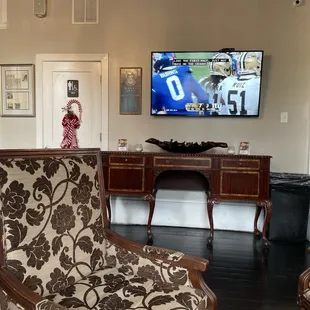 Lounge seating. The game is on with the sound.