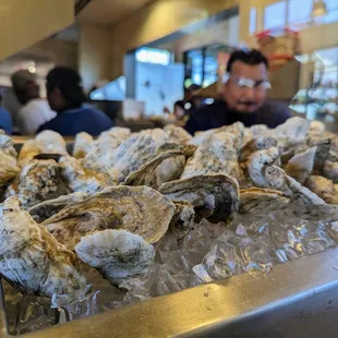 Inside. Daily oyster selection on display between entrance and dining room. Open kitchen.