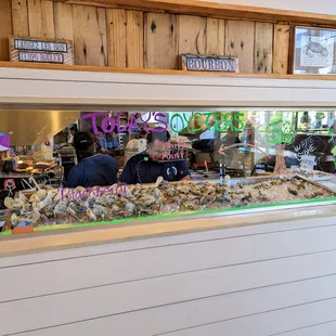 Inside. Daily oyster selection on display between entrance and dining room. Open kitchen.