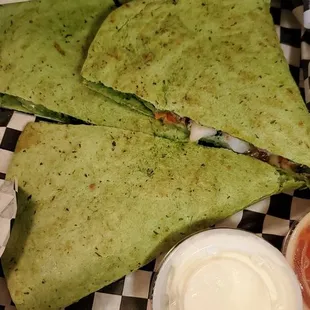 a wrap with a side of ketchup