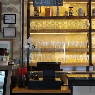 a bar with a lot of wine glasses