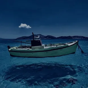 a boat in the middle of the ocean