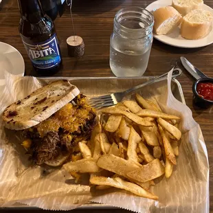 Grilled brisket cheese sandwich with fries