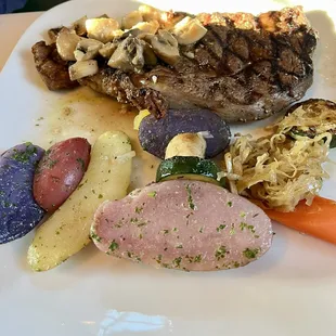 Ribeye with fingerling potatoes, vegetables and cabbage.