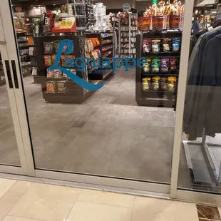 a view of a store through a glass door