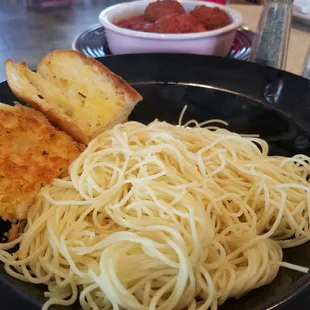 Spaghetti and meatballs with sauce on side