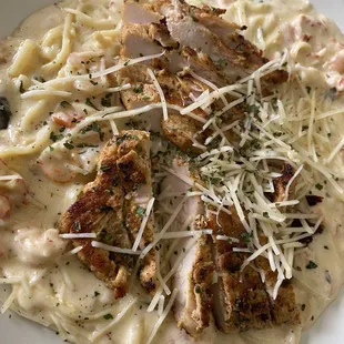Lagniappe pasta - shrimp , crawfish and grilled chicken. Very good and super creamy... enough food for two or three people.