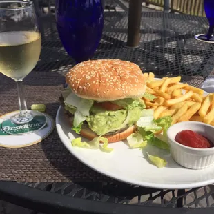 Spanish Burger with a special order of guac (comes with fries) and a free glass of Pinot Grigio for checking in on Yelp. Awesome!