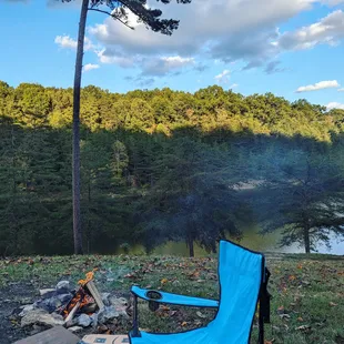 a camping chair by a campfire