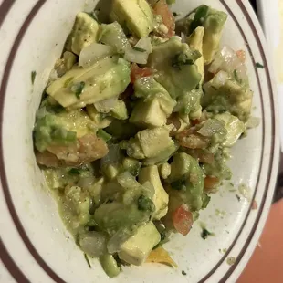 Guacamole Casero (chunky guacamole salsa), after we had eaten half of it. The potion is huge!