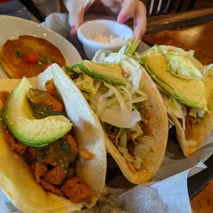 Al pastor (left) and carnitas (two right)
