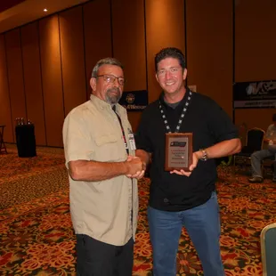 Massad Ayoob congratulating the 2013 IDPA National Championship placement ceremony.