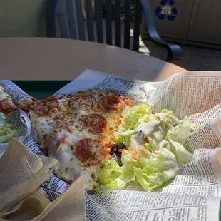 Pepperoni pizza with a side salad