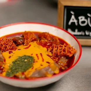 Abula is the street name for the holy trinity of amala, ewedu and gbegiri, garnished with our signature palm oil stew and assortment of meat