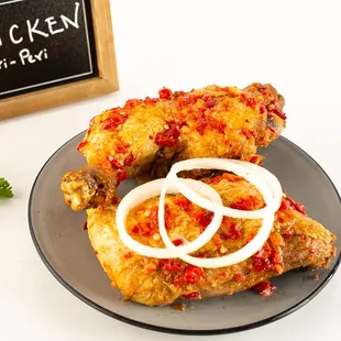 Enjoy our chicken peri-peri: fried chicken leg quarters sautéed in delicious peppers for a flavorful kick