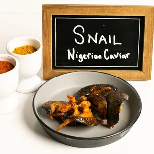 Juicy Jumbo snails prepared in delicious red stew. A local delicacy