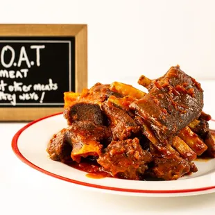 Experience the succulent taste of tender cooked goat meat, bursting with flavor and cooked in yummy stew