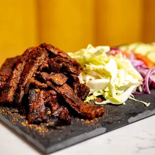 a plate of meat and vegetables