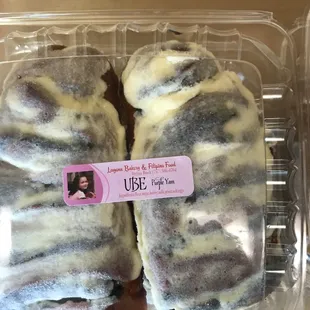 two donuts in a plastic container