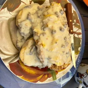 Chicken fried steak with biscuits and gravy
